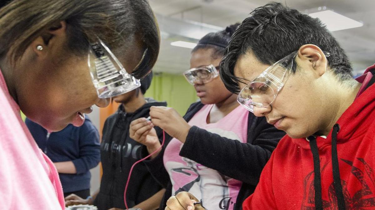 The KC STEM Alliance and the University of Missouri-Kansas City have set up an “engineering zone” workspace for students in engineering programs at Paseo and Lincoln Preparatory academies. Paseo Academy students Ja’Lyn Grayson and Juan Alfonso worked on a robot, as did Naudia Joseph behind them.