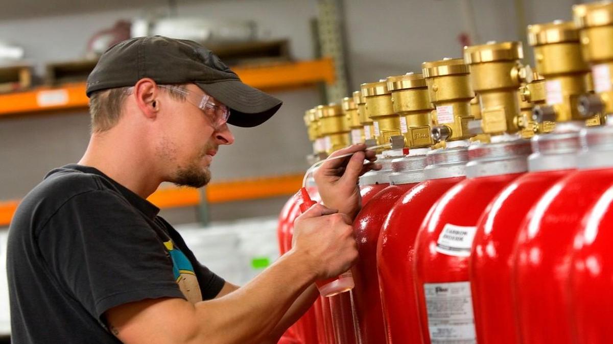 An employee of Fike Corp. tests fire suppression equipment at the company’s Blue Springs facility.