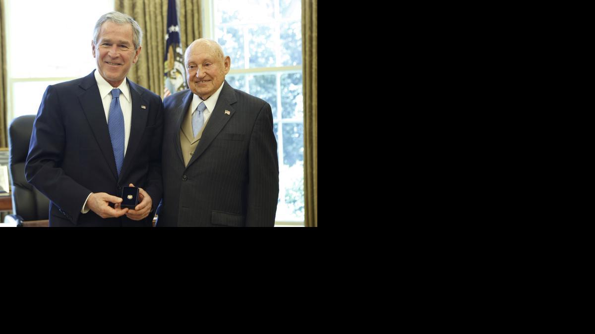 
Then President George W. Bush presents the Lifetime President's Volunteer Service Award to Chick fil-A Inc. founder S. Truett Cathy in the Oval Office of the White House in Washington
