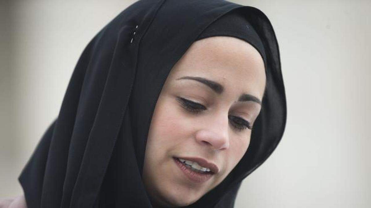 
Samantha Elauf stood outside the Supreme Court in Washington on Wednesday. The Muslim teenager was denied a job at Abercrombie & Fitch after she showed up at her employment interview wearing a black headscarf that conflicted with the company’s dress code. 
