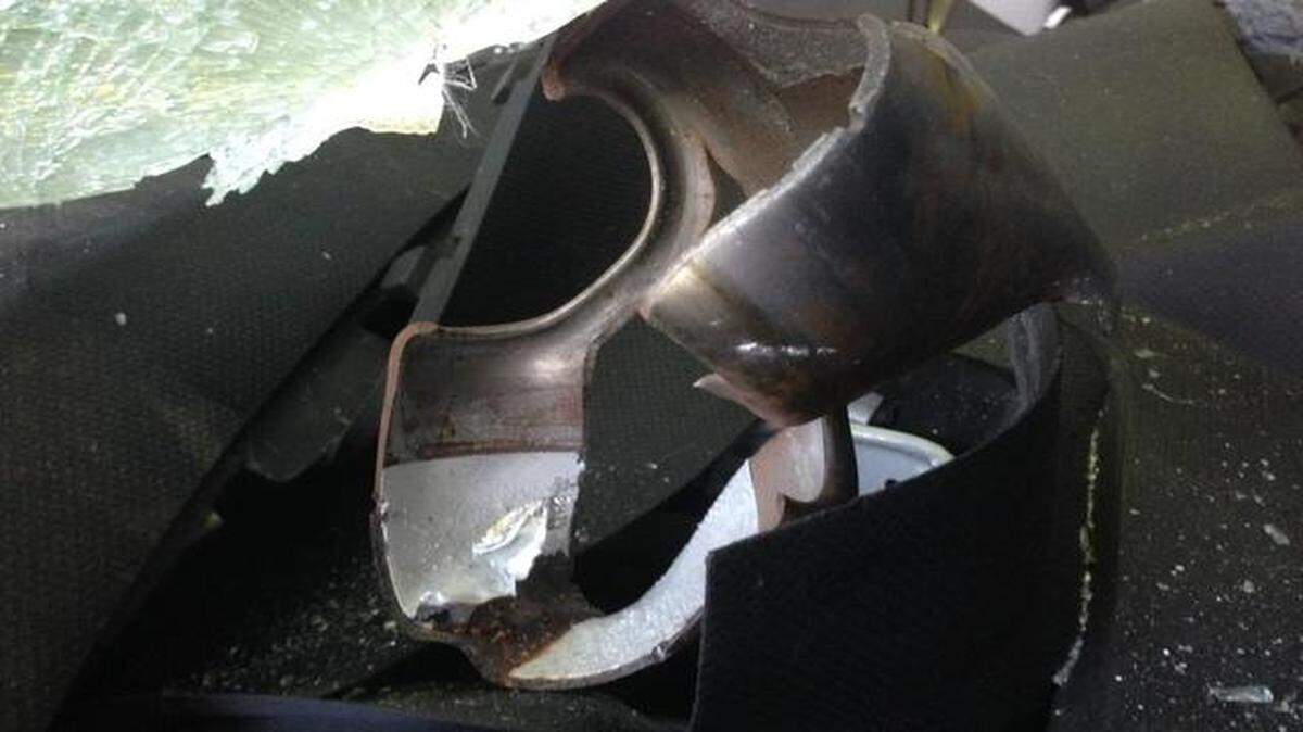 
The remains of a Takata air bag module are seen on the dashboard of a 2003 Toyota after the air bag ruptured during the car’s dismantling.
