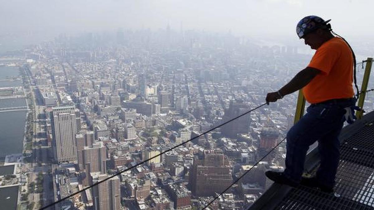 
A construction worker takes in the view from the top of One World Trade Center in New York
