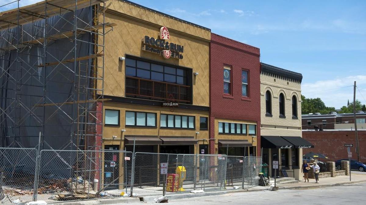 Scaffolding stands near where a wall collapsed in May adjacent to the Rock & Run Brewery and Pub in Liberty. The collapse forced the owners to close the business temporarily. Rock and Run Brewery & Pub recently reopened at 114 E. Kansas St., in the former The Bell restaurant and bar space (far right building) in Liberty, and customers were coming back.