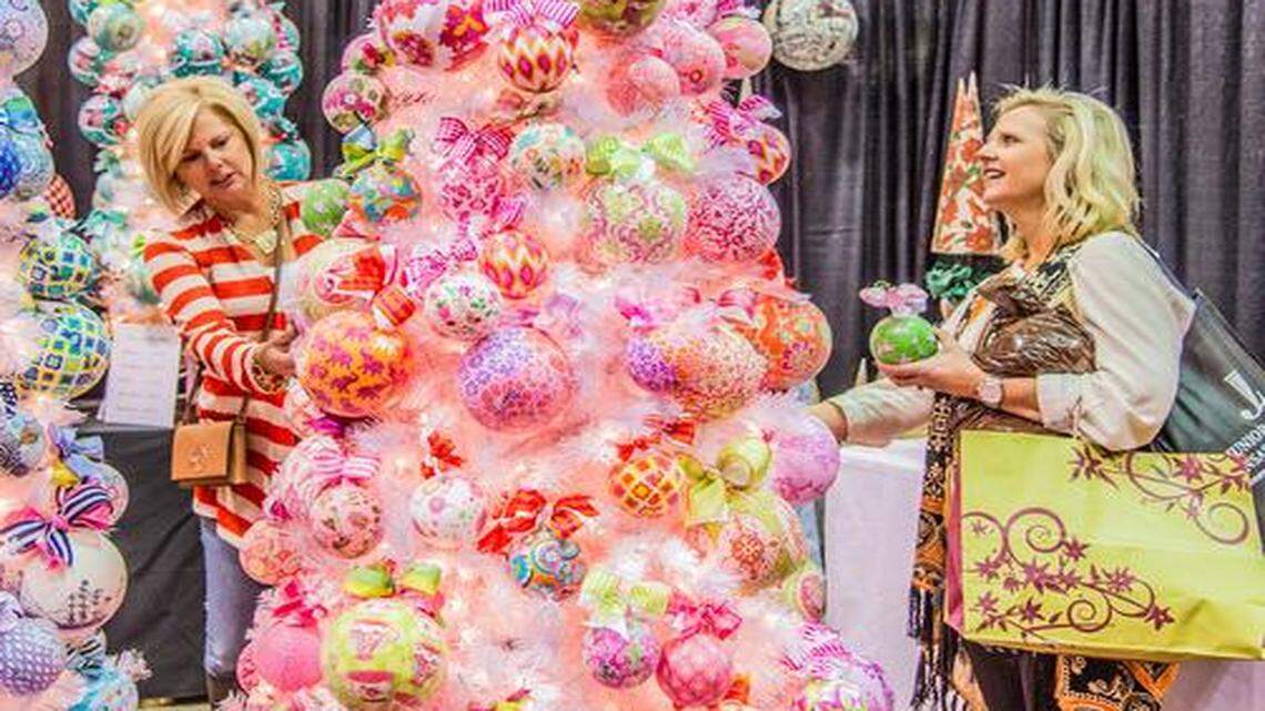 
Whitehead Studios from from Highwood, Ill., set up brilliantly decorated trees at the Junior League’s annual Holiday Mart in Bartle Hall. Nancy Newsham (left) and Jana Carani from St. Louis shopped for ornaments.
