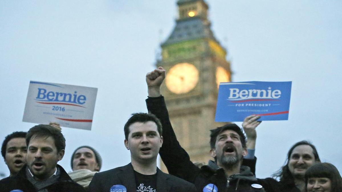 Supporters of Democratic candidate Bernie Sanders gathered in London on Tuesday as voting began in the U.S.