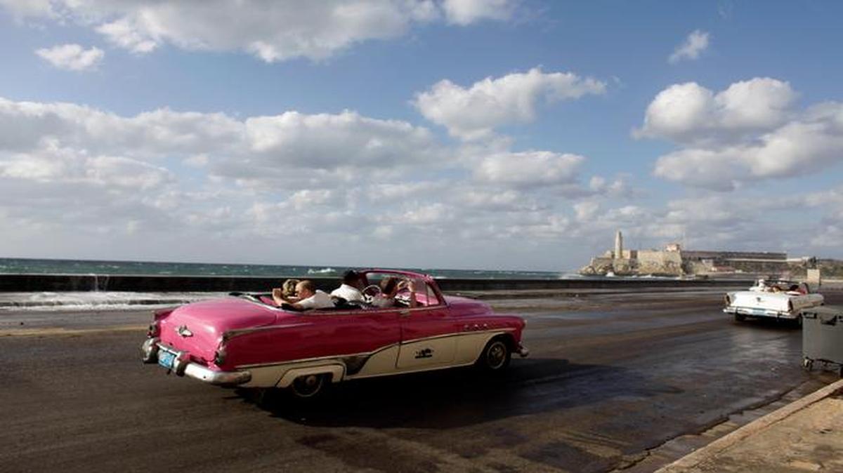 Cuba is known for keeping its classic cars rolling, like this one on Havana’s Malecon. But U.S. companies now could send new models to the island, though its an open question how much demand the relatively poor country will generate.