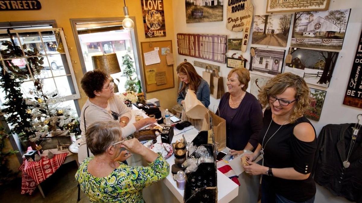 The Farm House Collection, which was bought by the Bohannon family in Jamesport in 2008, has added a shop in Parkville. Customers Sandy Hoffman (foreground, left) and Lynda Morrison were helped by Sarah Roos (left), Debbie Southards and Amanda (Bohannon) Riley on Nov. 2.