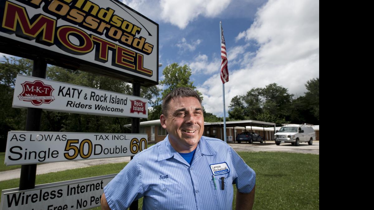  Scott Lawson, owner of the Windsor Crossroads Motel, stood near the sign for his business along Main Street in Windsor, Mo. Lawson gets some business from Katy Trail cyclists and is hoping for more once the Rock Island Trail is built.