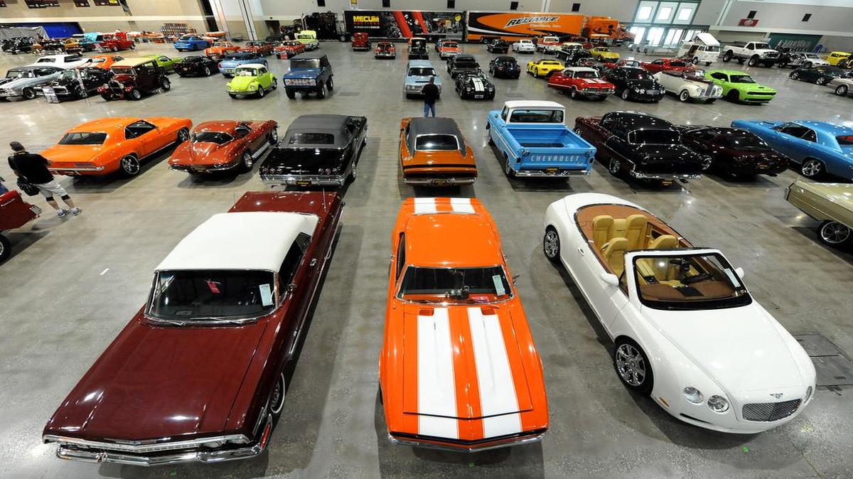 Mecum Auctions is holding its annual classic car sales event at Bartle Hall on Friday and Saturday. On Thursday, cars were unloaded and set up for display, including a 1967 Chevrolet Camaro RS 454.