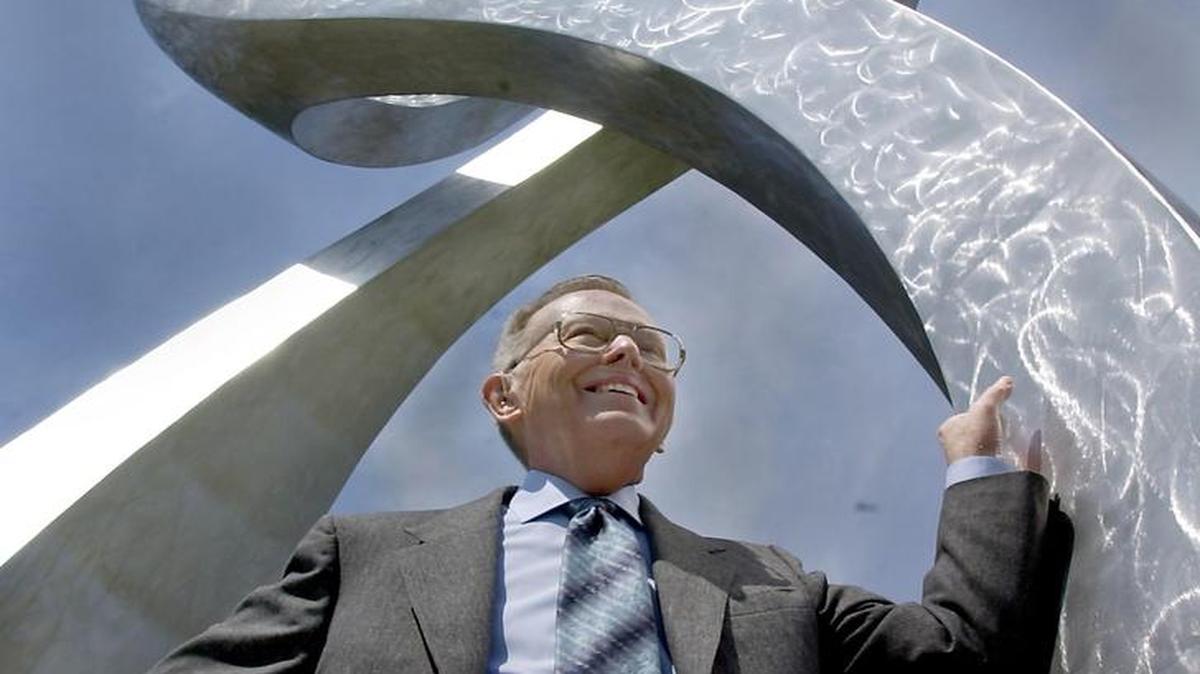 
James E. Stowers Jr., founder of American Century Investments, under the double helix sculpture at the Stowers Institute for Medical Research in a 2001 photo. 
