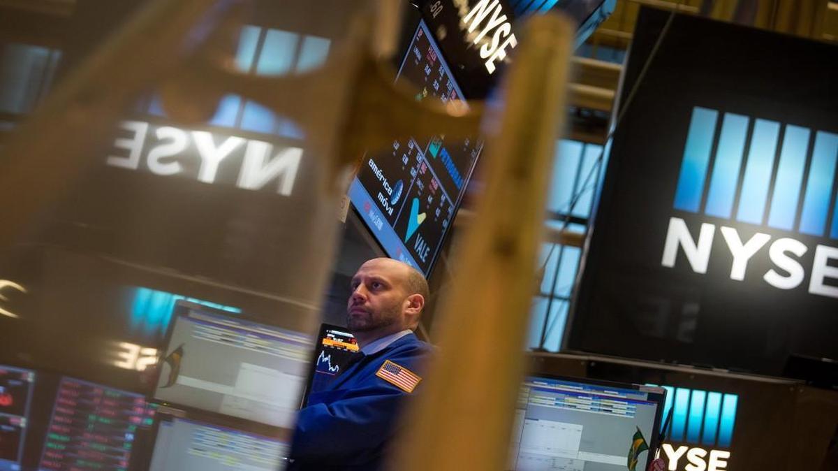 A trader worked Friday on the floor of the New York Stock Exchange.