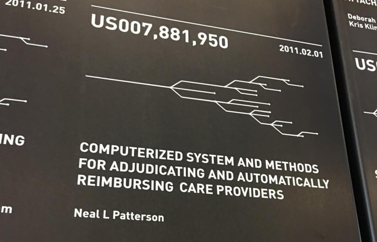 A plaque on the wall at Cerner’s new South Kansas City office campus shows that Neal Patterson himself won patents connected with Cerner’s business.