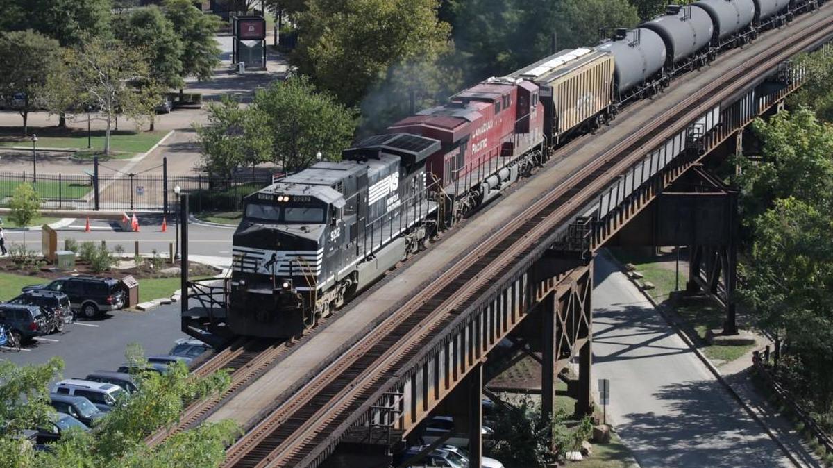 Norfolk Southern and Canadian Pacific locomotives lead an empty oil train west at Richmond, Va.