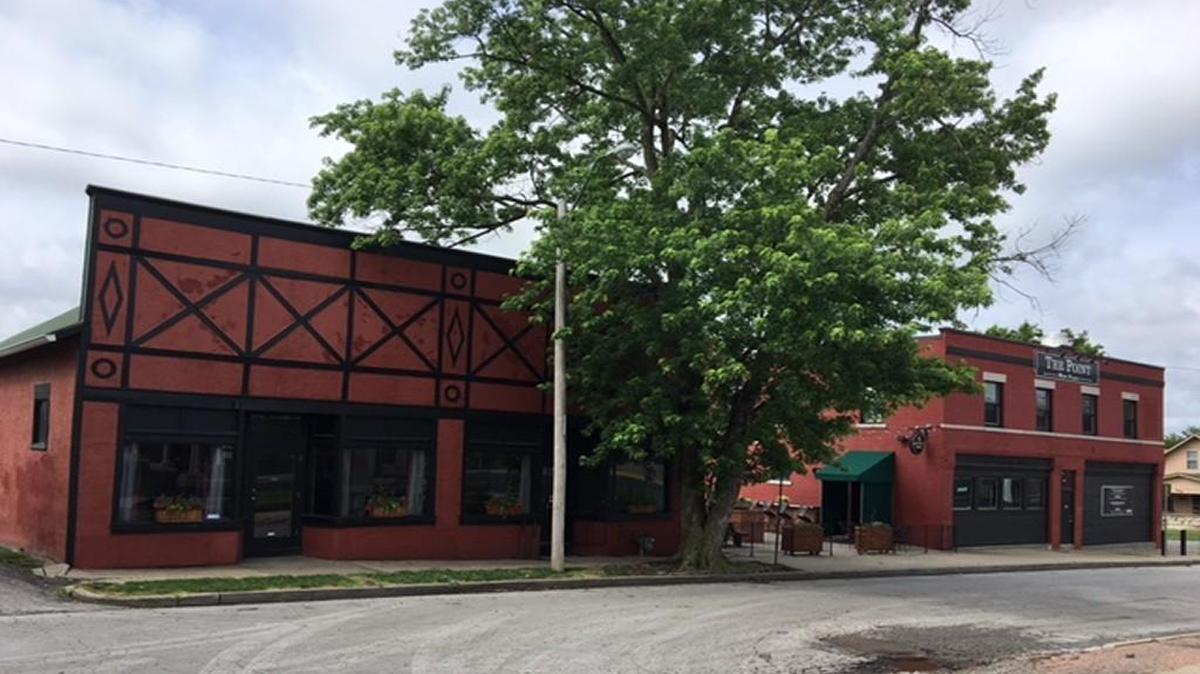 The Point, a bar at 44th Street and Belleview Avenue, (the building on the right) is dealing with a rezoning problem to allow it to continue to operate as a tavern and to permit a different retail use, possibly a coffee house, in the building on the left.