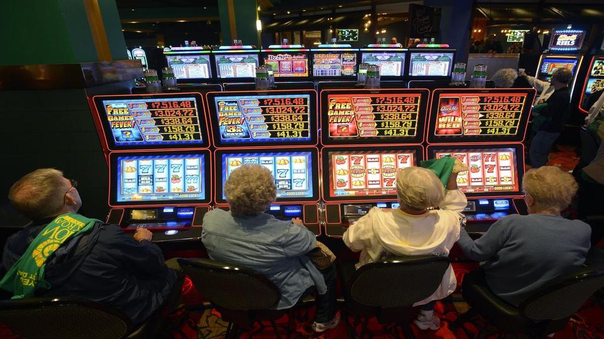 
Gamblers play electronic slot machines Tuesday at the Yellow Brick Road Casino in Chittenango, N.Y. 

