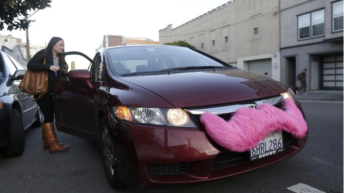 Lyft cars feature the distinctive pink mustache.