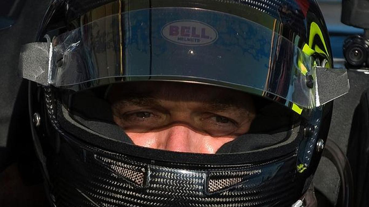 In this March 19, 2010, photo, Level 5 Motorsports driver Scott Tucker waits in his Oreca FLM09 on pit row during a break in the morning practice session for the American Le Mans Series' 12 Hours of Sebring auto race in Sebring, Fla.