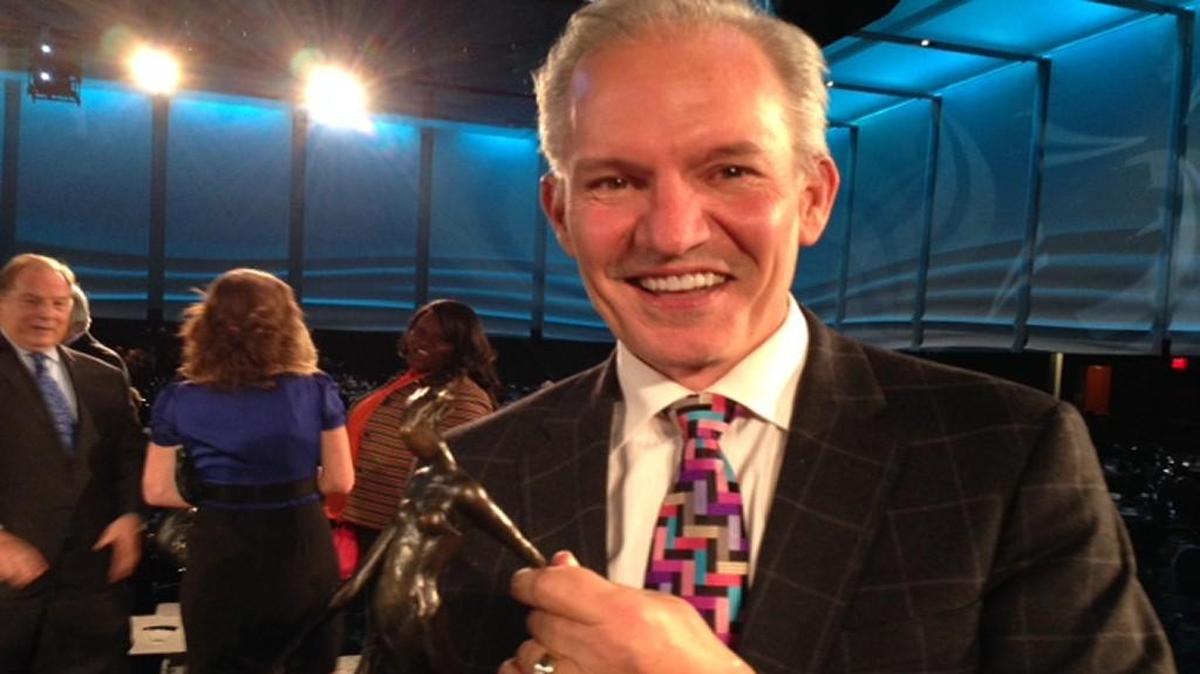 Burns & McDonnell CEO Greg Graves smiles with his Kansas Citian of the Year award after Thursday’s Greater Kansas City Chamber of Commerce dinner.
