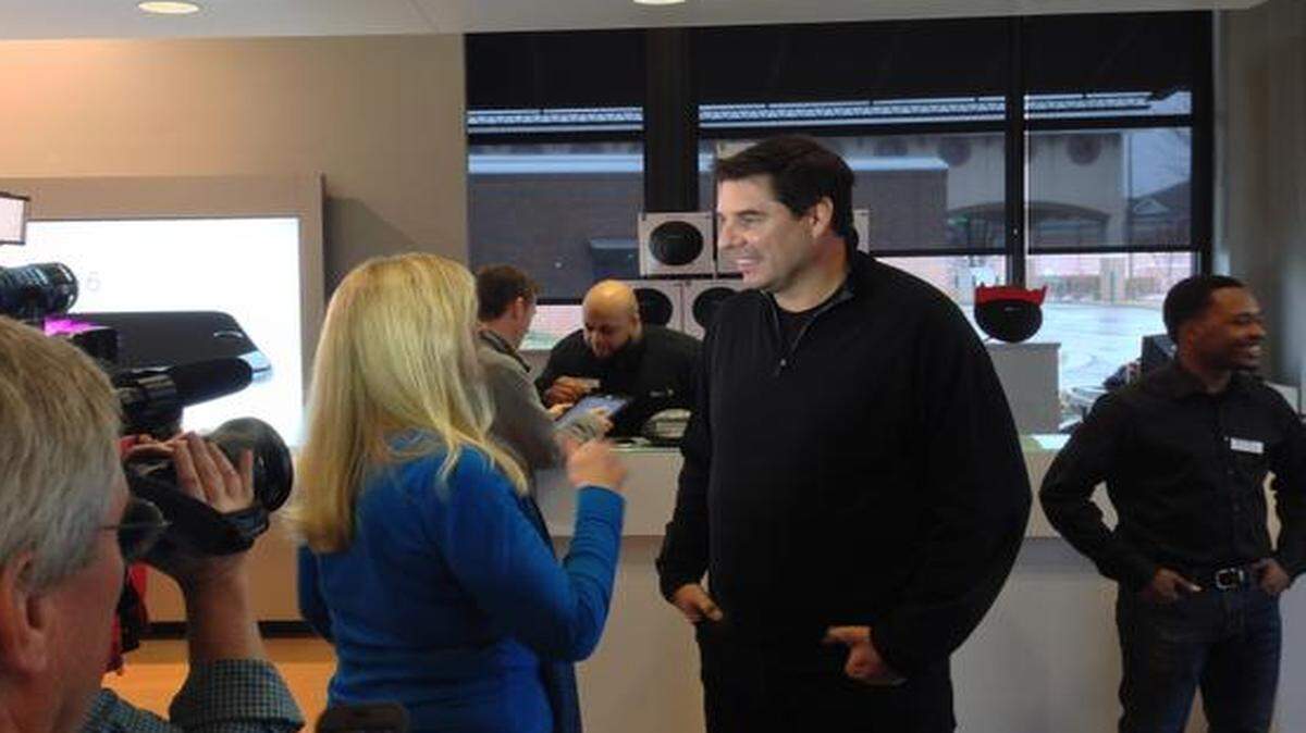 
Sprint CEO Marcelo Claure talked Friday with a company official before he spoke to the news media at the company’s Leawood store. 
