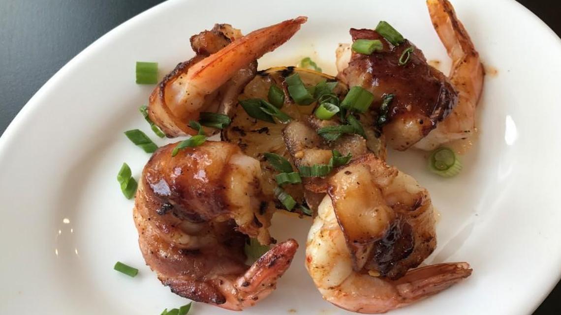 Broadway Bistro’s bacon wrapped shrimp appetizer with apricot BBQ sauce.