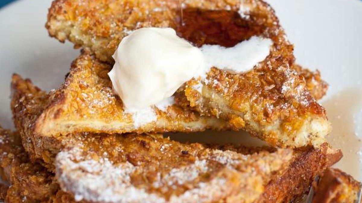 Shack’s Big Crunch with brioche French toast encrusted with corn flakes and topped with powdered sugar for $9