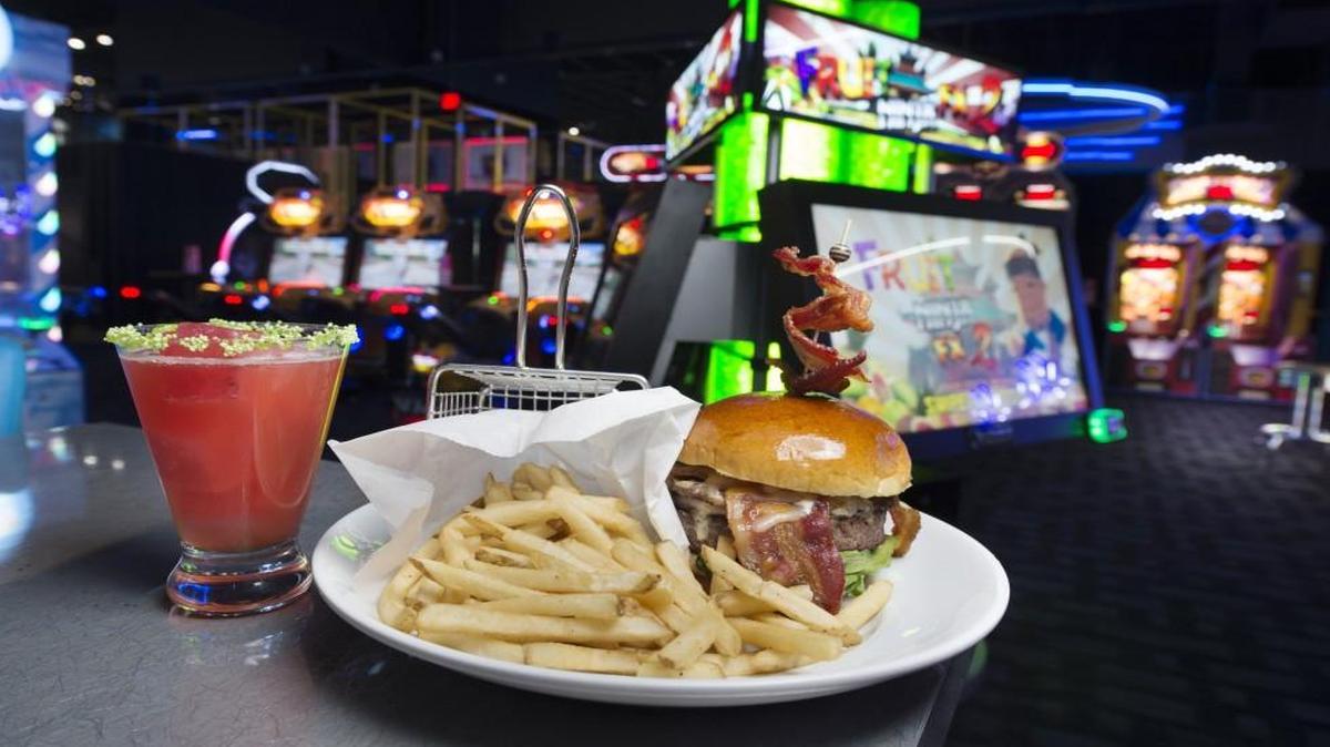 The BBBacon Burger and a Strawberry Watermelon Margarita are on the menu at the new Dave & Buster’s. About 49 percent of the company’s sales, on average, are from food and drink.