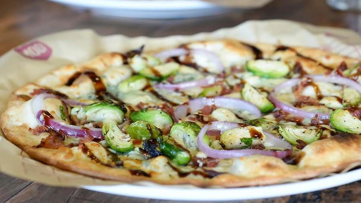 The Kasey with olive oil, roasted Brussels sprouts, bacon, gorgonzola, red onion and balsamic fig glaze.