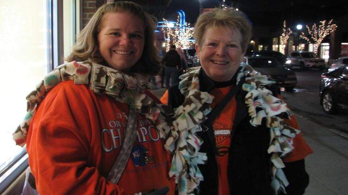 
Angie Burns (left) and her mother, Pattie Rodriguez, were among the shoppers who on Wednesday night came to the Zona Rosa shopping district for a new holiday event, “Orange is the New Black Friday.”
