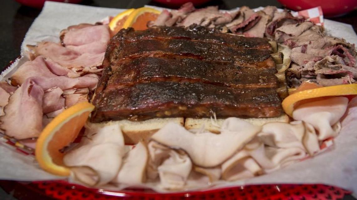 A combination platter at P. Moore & Moore BBQ comes with a choice of one of three sides: creamy corn, baked beans or potato salad.