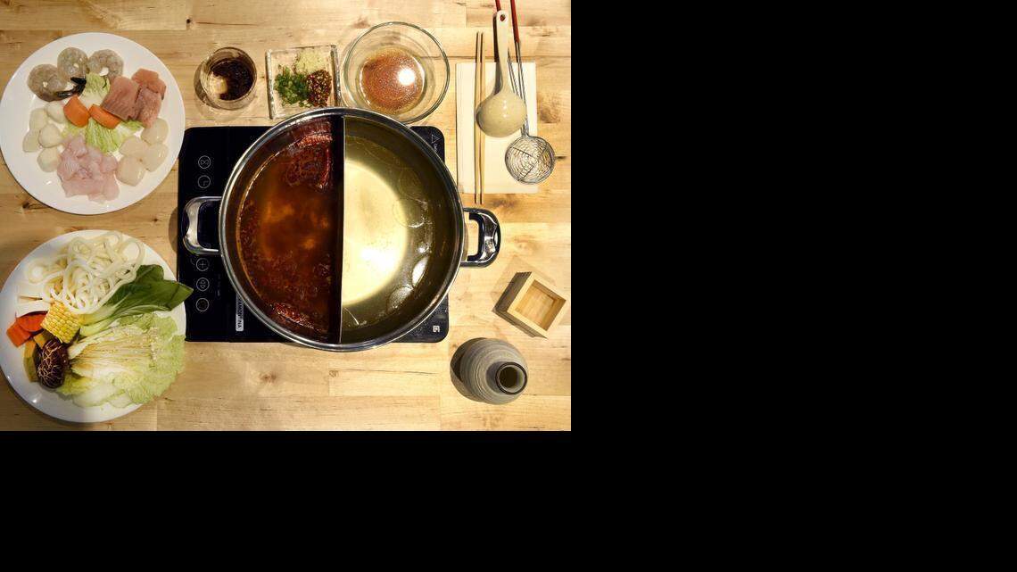 
The seafood and veggie plate from Q Hot Pot Japanese Fondue & Asian Tapas Bar at Zona Rosa. Included are Chinese and chicken broths, Chinese barbecue sauce, scallions and sake.
