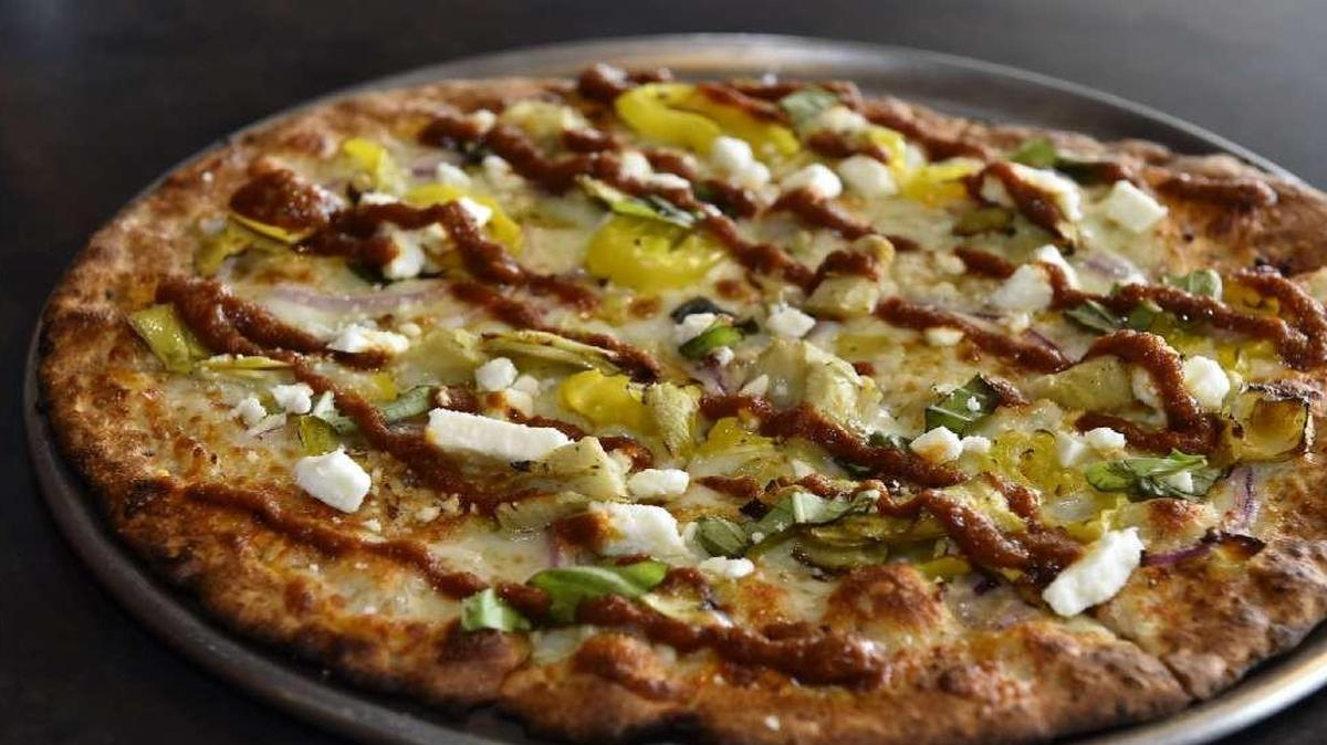 Pie Five Pizza bakes custom pies in 145 seconds in a special oven.