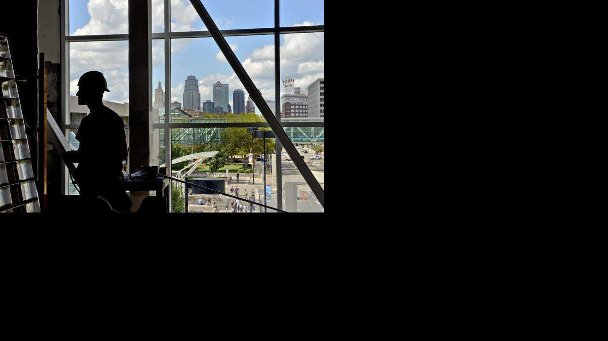 
Chad Ellinger worked in front of a window with a view of downtown Kansas City during the construction of the new Halls Crown Center store in Kansas City.
