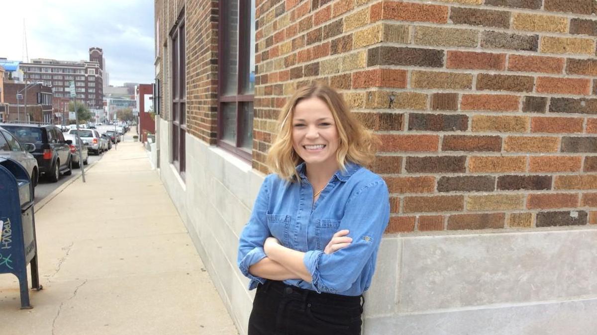 Laura Ross in front of Bride, now under construction in the Crossroads.