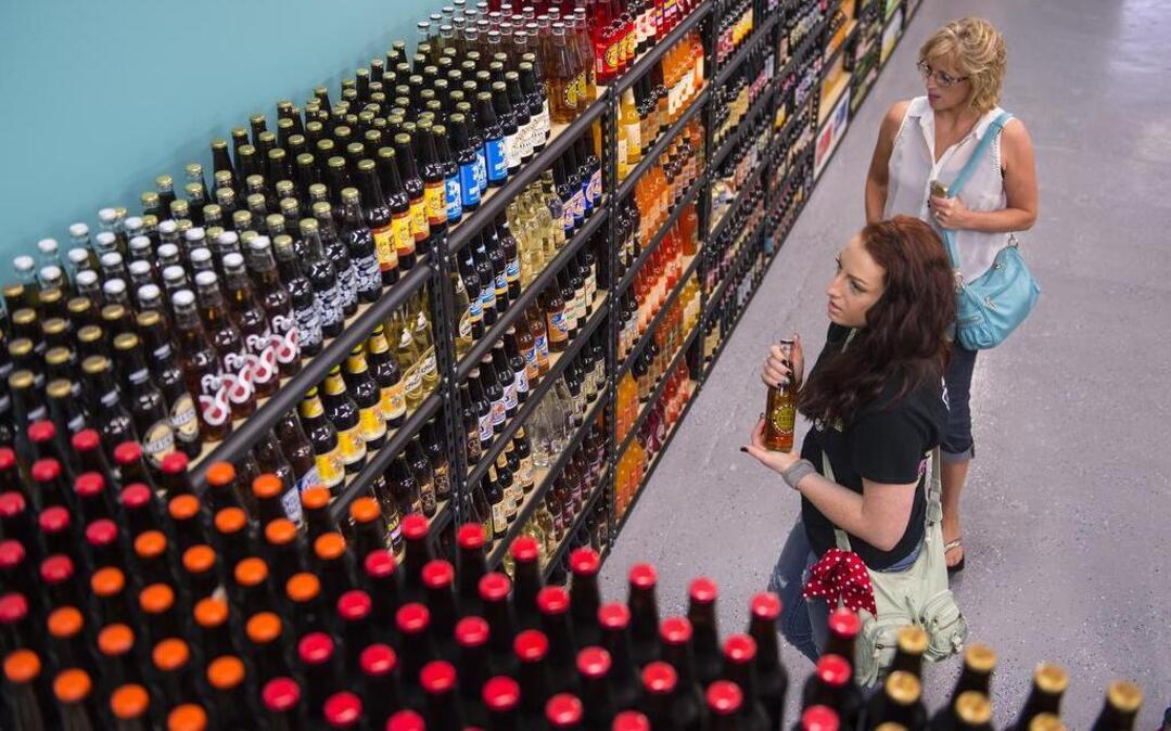 
Mother and daughter Janette Ward (front) and Emily Pierce browsed the shelves for a soda recently at KC Soda Co. at the Legends Outlets in Kansas City, Kan.

