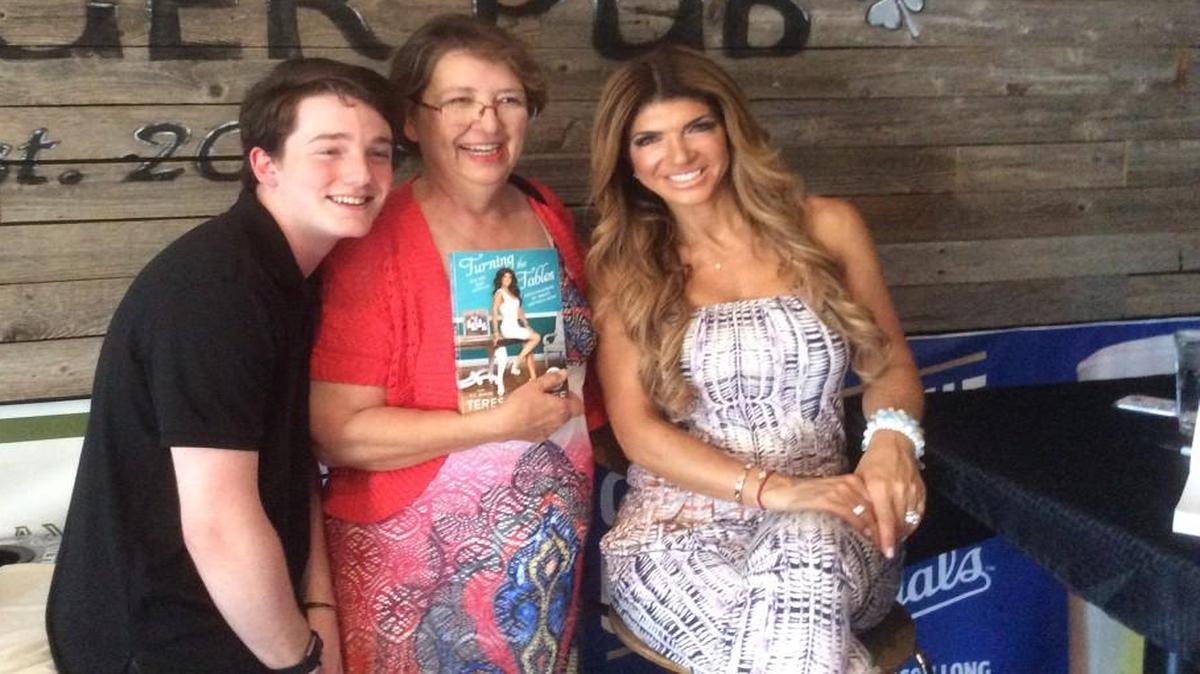 Presley Busenbarrick, left, and Donna Leap meet Real Housewife Teresa Giudice at a book signing in Westport on Saturday.