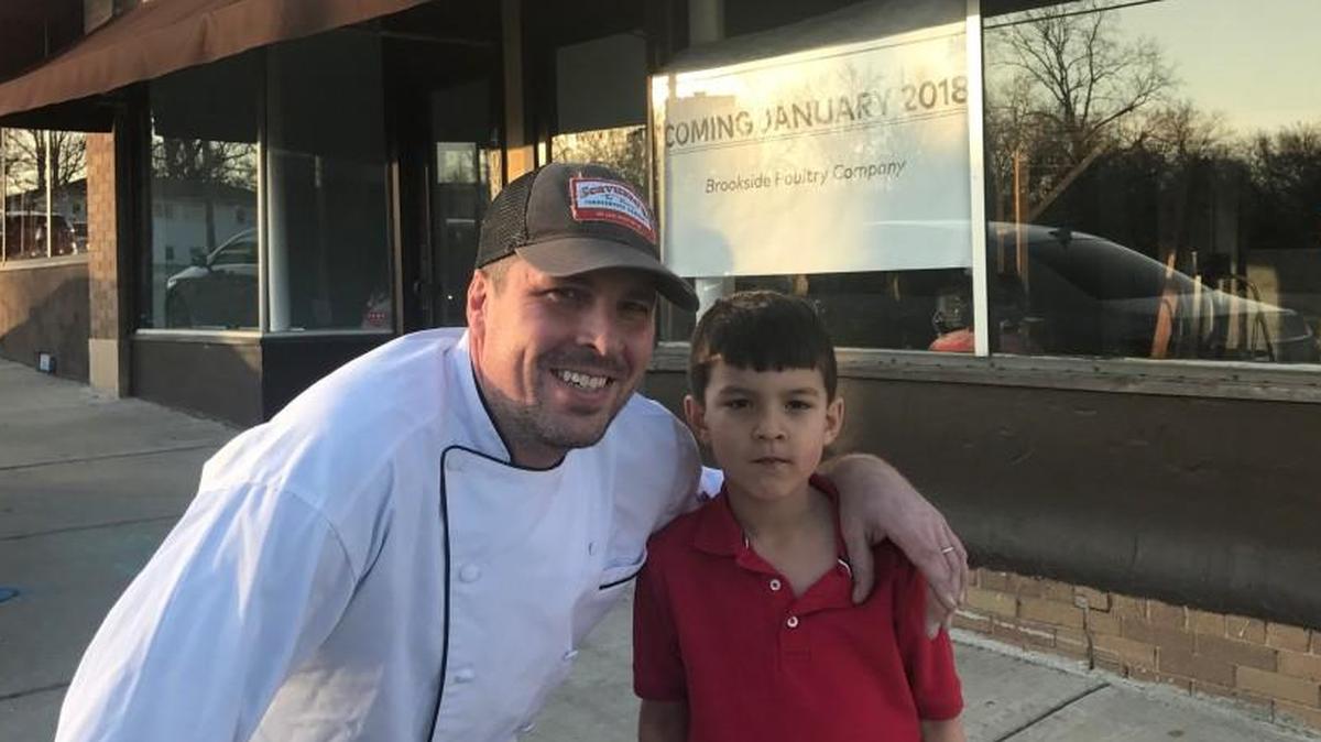 Chef Charles d’Ablaing and his son, Philipe, 5, in front on the new Brookside Poultry Co.