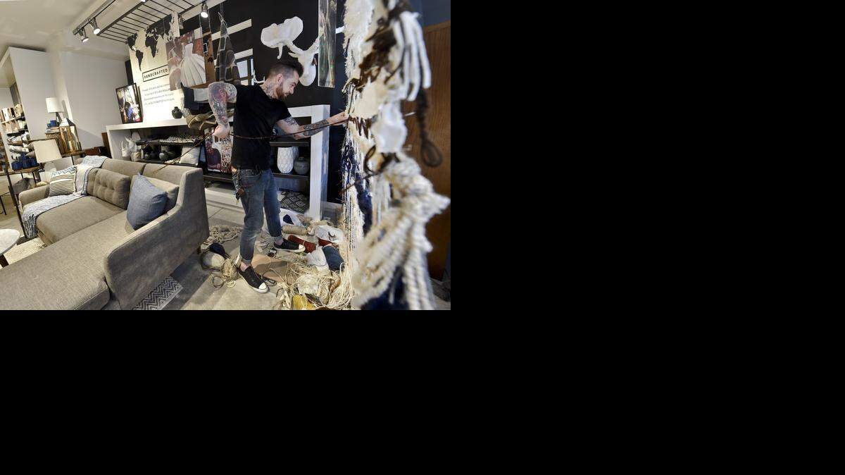 West Elm offers free consultations with its home stylists, either in the store or at a customer’s home. Lead in-home stylist William Baumgarten worked on a loom divider Tuesday at the new location on the Country Club Plaza.