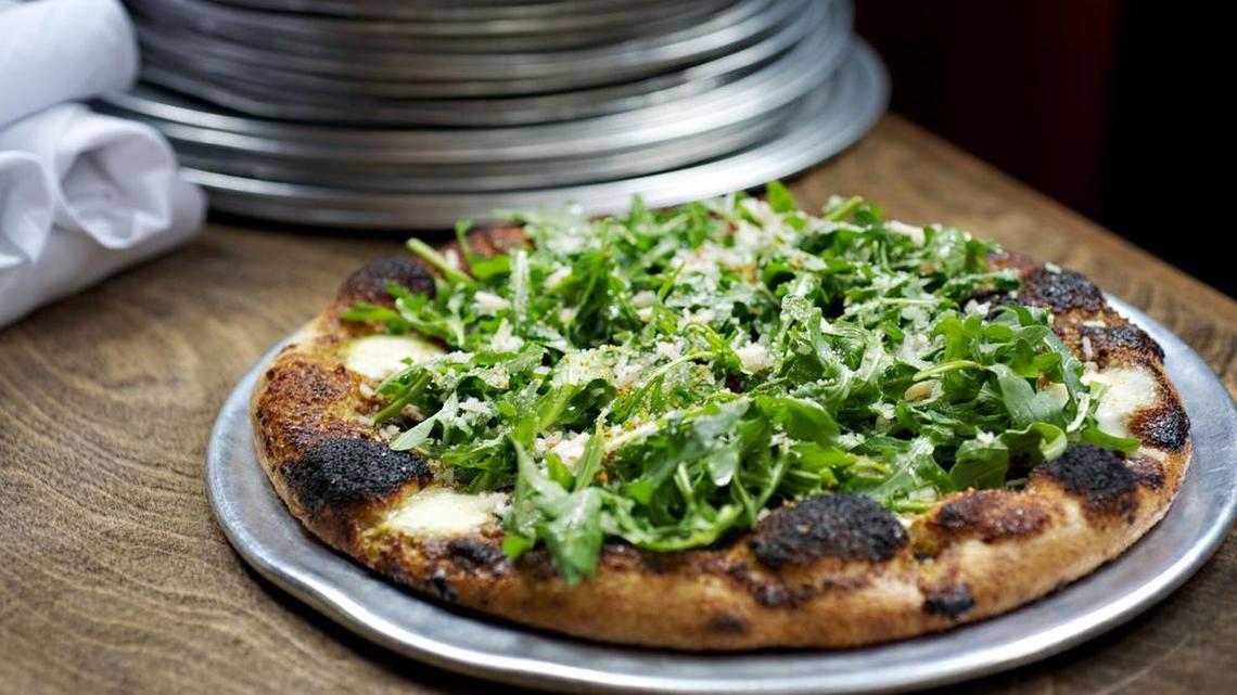 Zavino’s The Stache pizza with whole wheat crust, pistachio pesto, mozzarella, Parmesan, lemon vinaigrette and baby arugula.