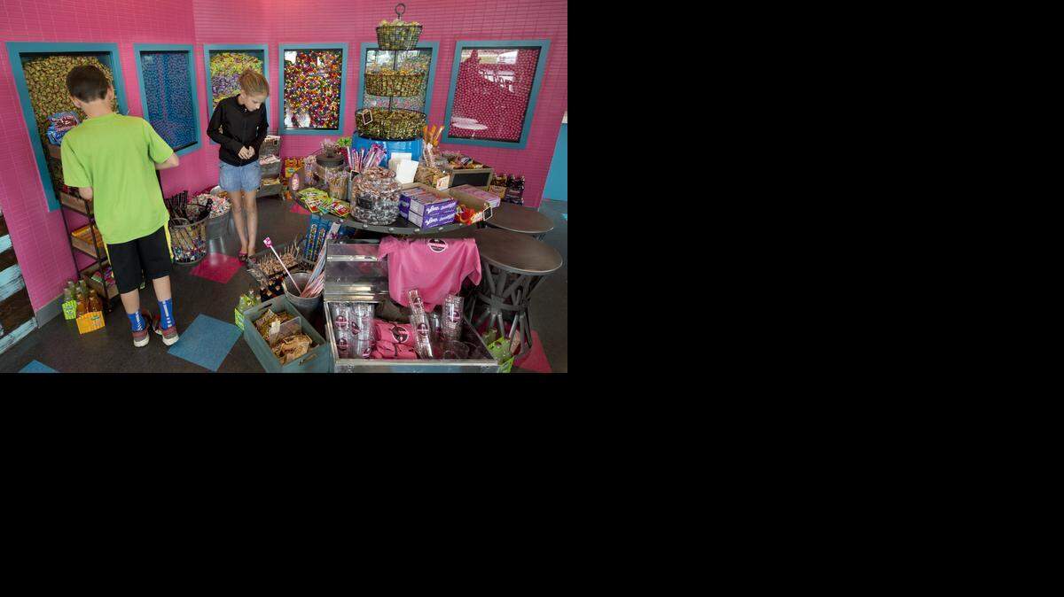 
Smallcakes Creamery & Novelities has opened at 6936 W. 135th Street in Overland Park. On Friday, Sept. 19, 2014, twins Sam (left) and Sydney Bonder explored the store's selection of candy.
