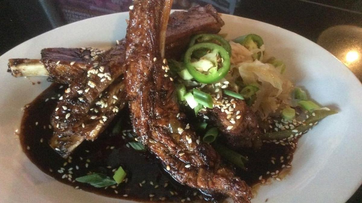 RecordBar’s Seoul Ribs — slow-braised ribs with a choice of Korean sauce with Asian spicy slaw or with Zim’s sauce and Gorgonzola slaw for $12.