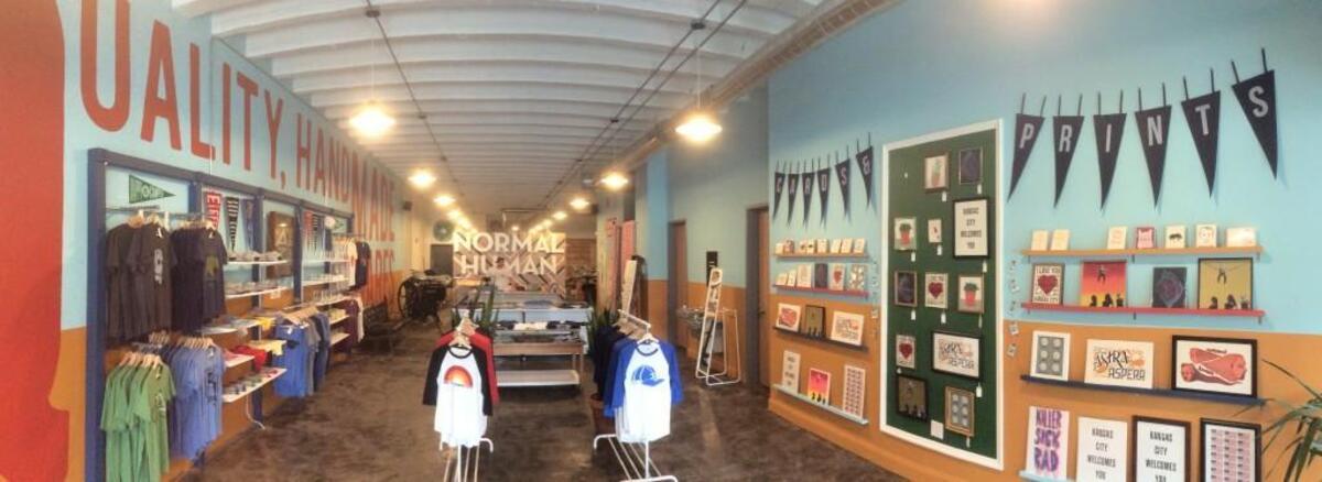 Normal Human has opened a retail shop, with its screen-printing equipment in back, at 1815 McGee St.