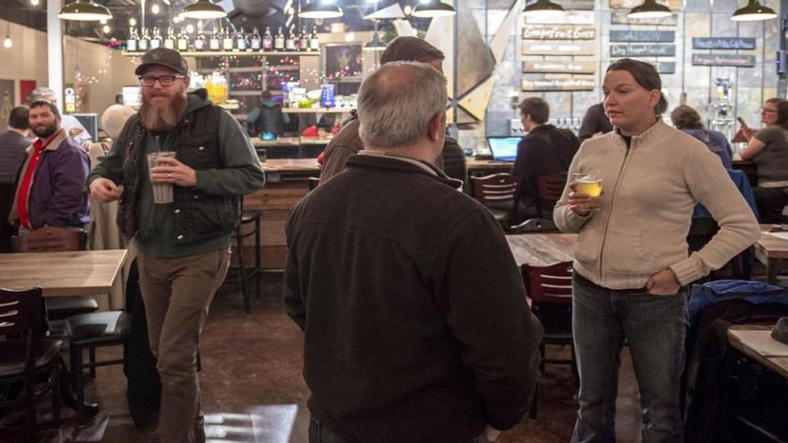 Customers enjoy the atmosphere and a few beers in the recently opened taproom at Crane Brewing Co. in Raytown. The taproom is open Tuesday through Saturday.