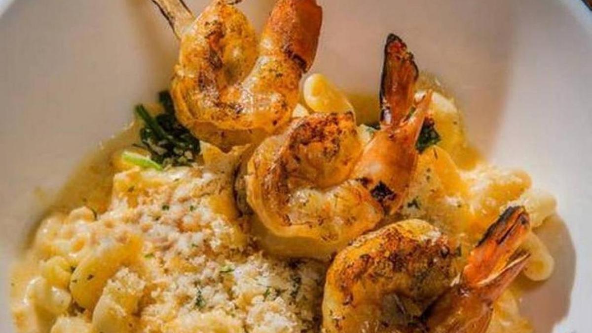 At the Blue Moose, one of the customizable mac-and-cheese dishes includes white truffle oil and wood-grilled shrimp.