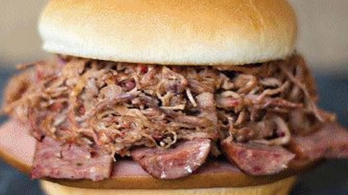 The Heisman with choice of chopped brisket or pulled pork and a slice of bologna and hot link.