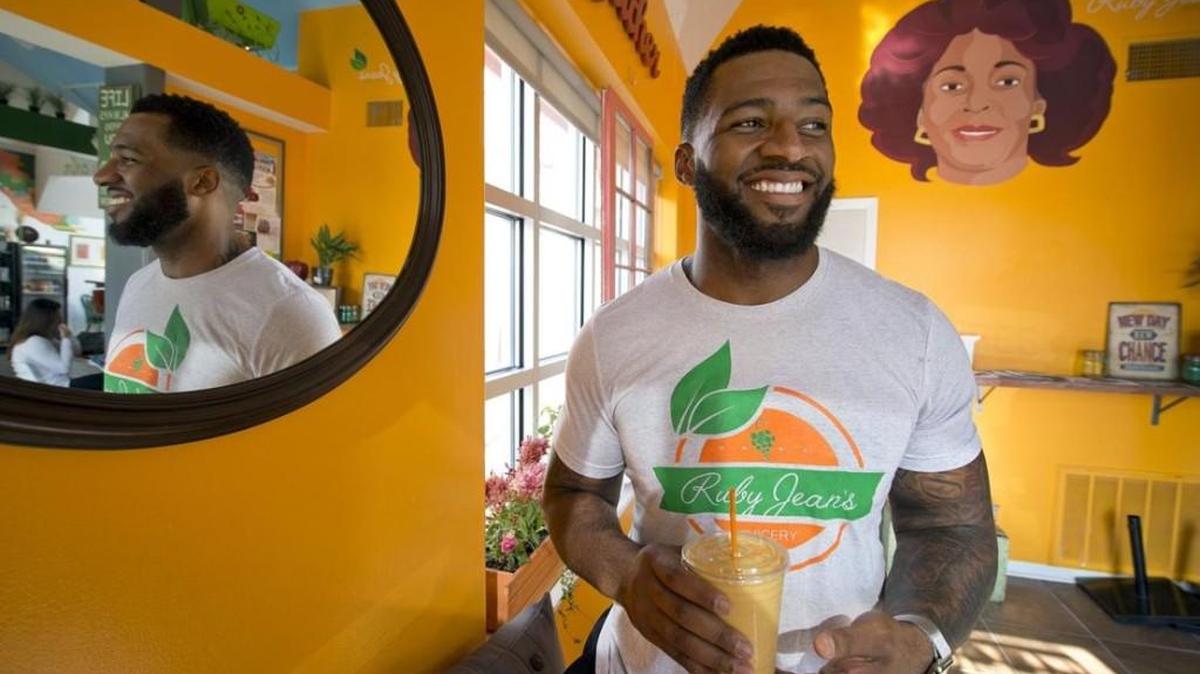 Chris Goode is owner of Ruby Jean's Juicery, 4001 Broadway. The business is named for his grandmother. A portrait of her can be seen on the wall behind Goode.