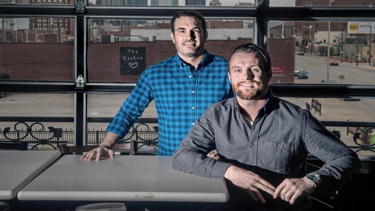 New owners Bret Springs (sitting) and Zach Marten have new plans for the Cashew.
