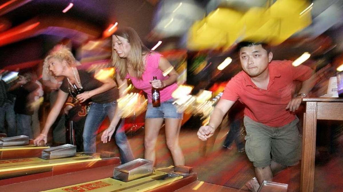 
Skee Ball players at the Dave & Buster’s in the Legends Outlets.
