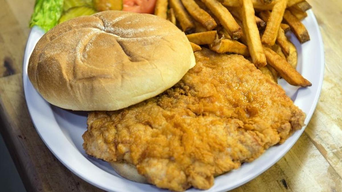 
A pork tenderloin sandwich with hand-cut fries is one of lunch items available at Cook’s Corner Cafe  in Smithville. 
