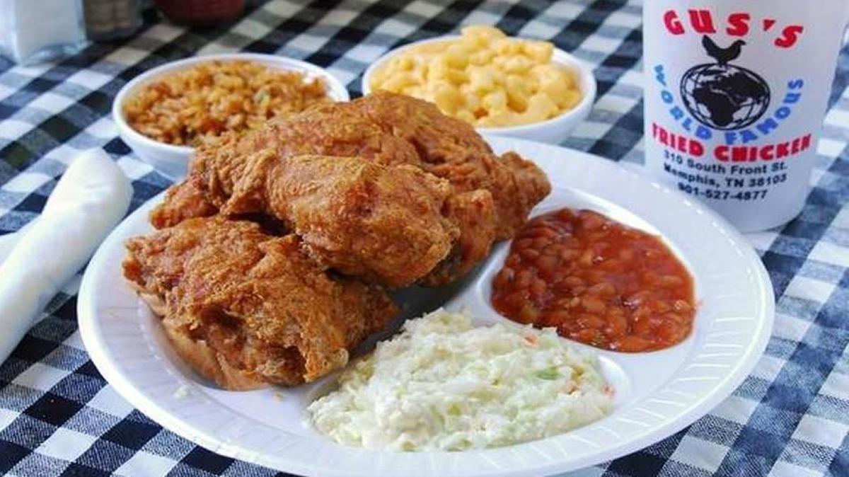 Gus’s serves spicy friend chicken along with baked beans, fried green tomatoes, mashed potatoes and gravy, fried okra and slaw.