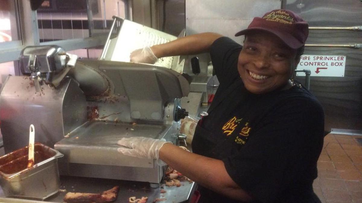 Karen Woods, slicer at Arthur Bryant’s, has already had a run-in with that “big old blade.”